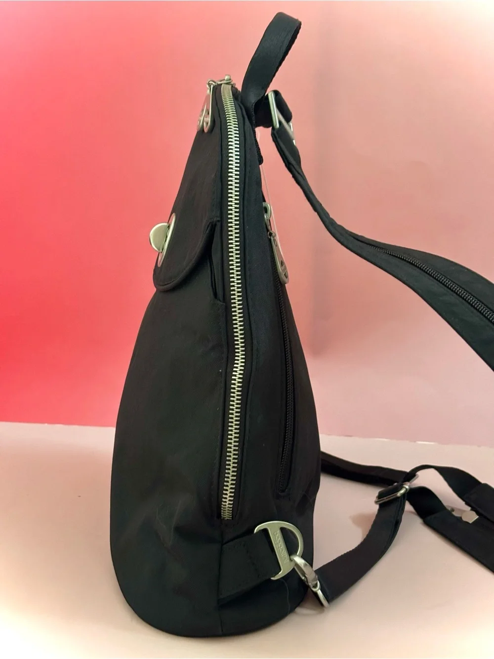 Baggallini Black Sling Cairo Backpack with Turn-Lock Detail-